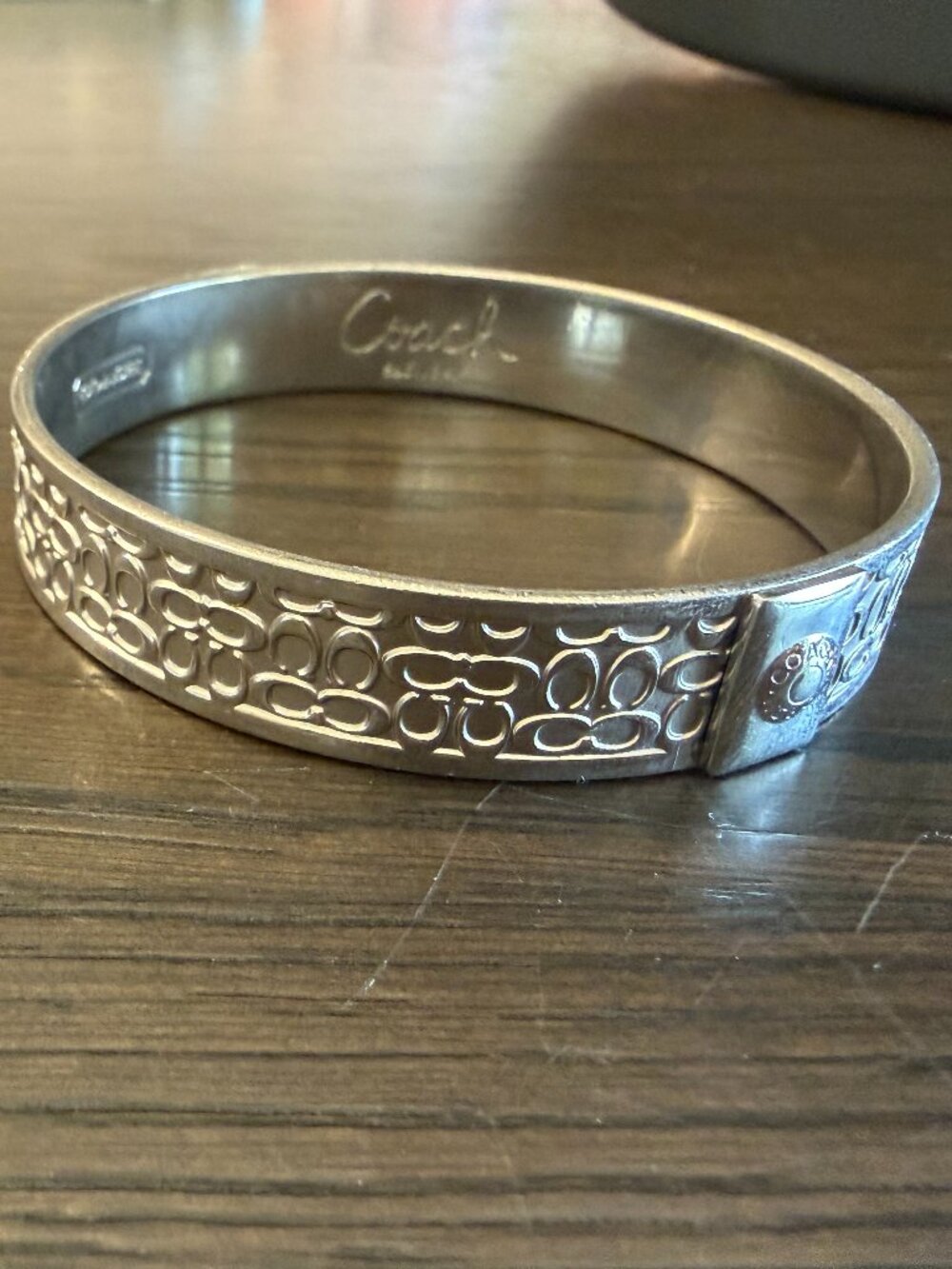 Silver Coach Bangle with Raised "C" Logo Design